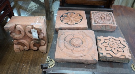 Five square terracotta tiles, largest 22 x 23cm